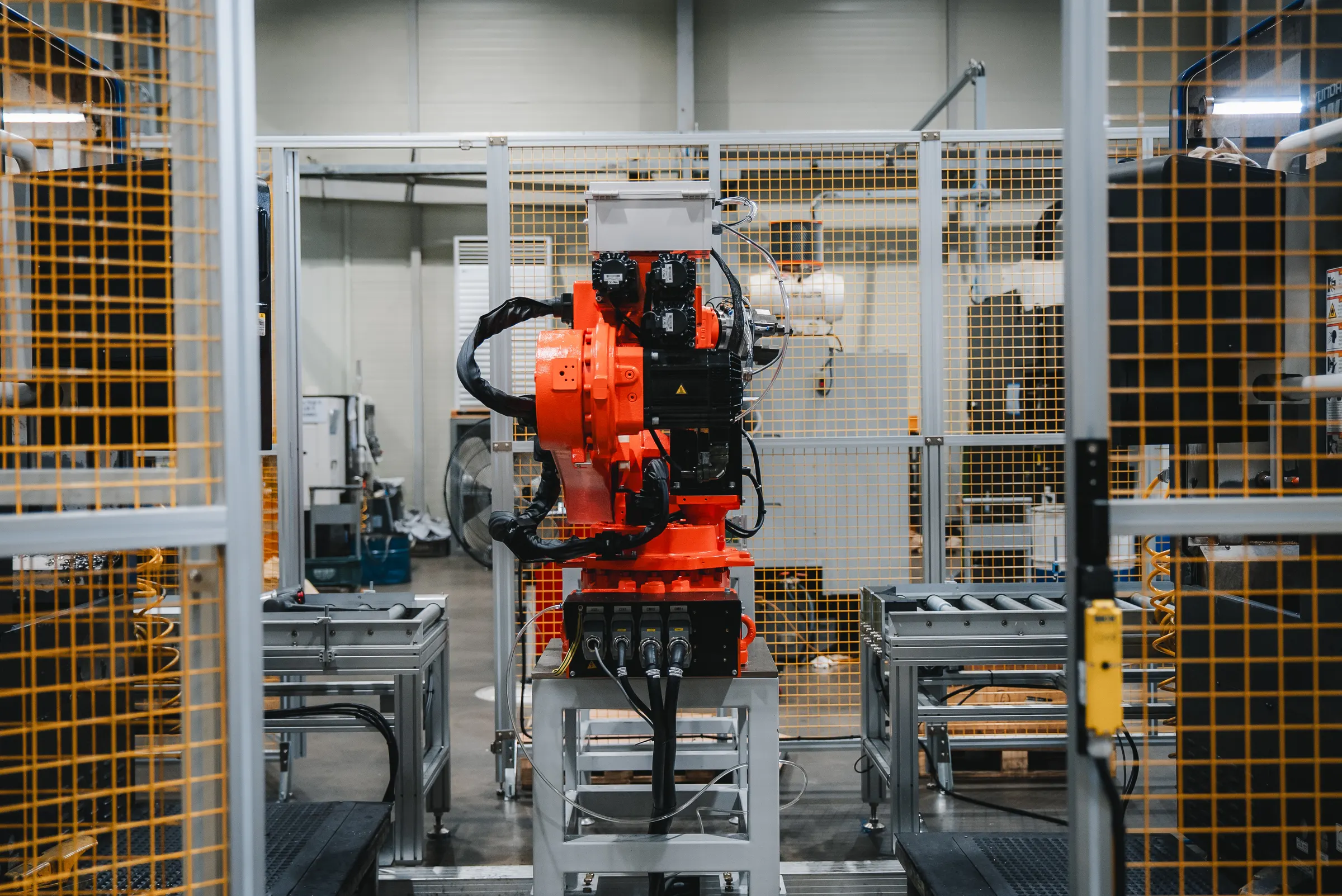 Industrial robot arm on the Neotech production floor